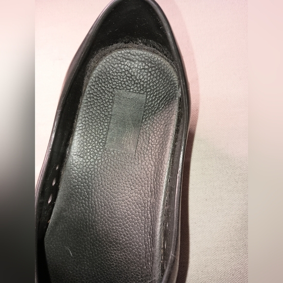 Elegance in Every Step: Embossed Floral Black Clogs by Dansko (#1,230) - Picture 3 of 6